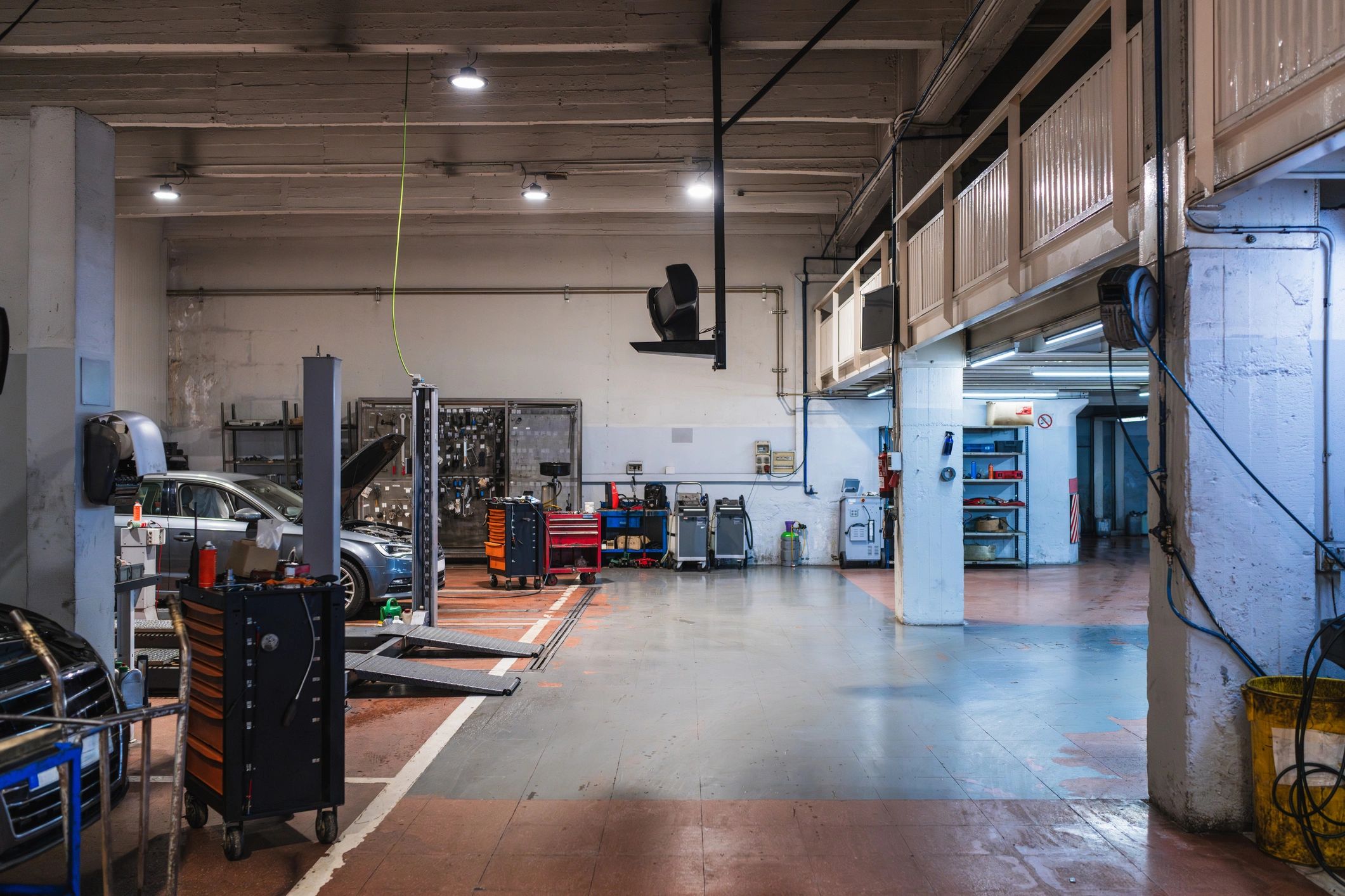 Auto repair shop service bay with vehicle lifts